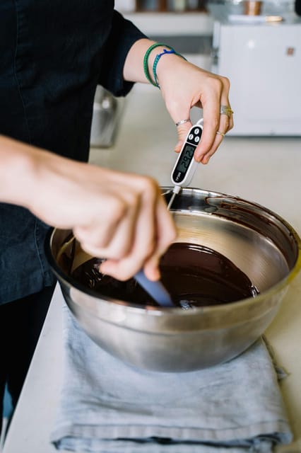 Bruges: Belgian Chocolate Making Workshop with Beer Tasting - Making the praline shells with dark Callebaut chocolate