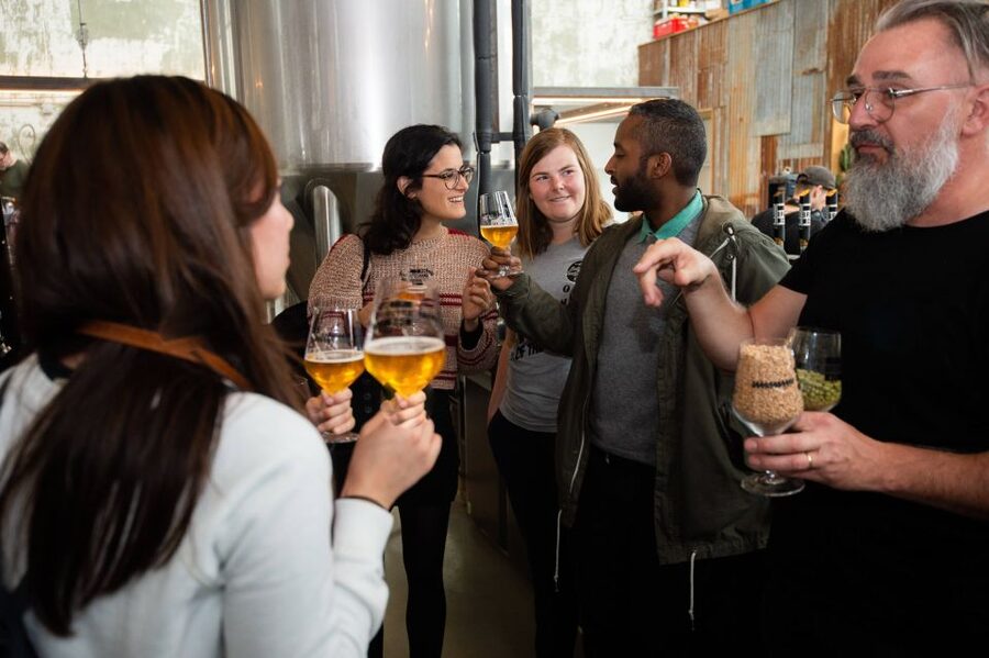 Ghent: Brewery visit + Beer Tasting tour with a Young Local - Ghent with a beer glass in hand